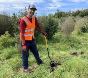Brad Taylor of Walking Legends participates in planting native species during Conservation Week 2022