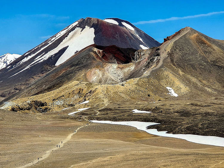 View of the Tongariro Volcanic Massif with Mt. Ngauruhoe in the distance and the scree slope on the Tongariro Alpine Crossing evident in the foreground