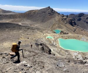 A hikers descends the scree slope on the Tongariro Alpine Crossing